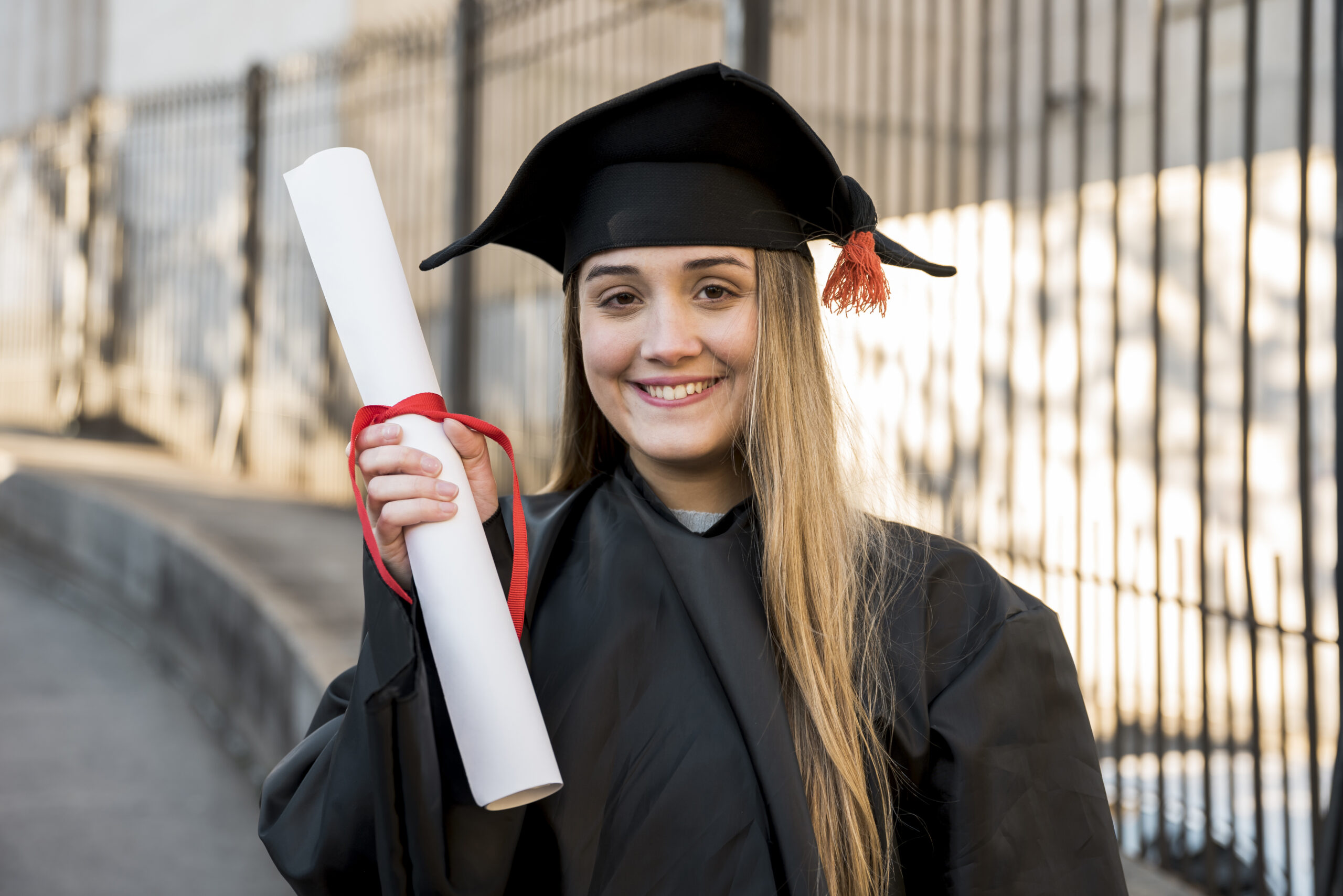 college-graduate-holding-her-certificate